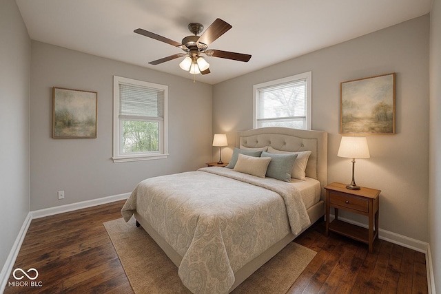 4621 E 17th St, Indianapolis, IN 46218 - bedroom with multiple windows, baseboards, and dark wood-style floors