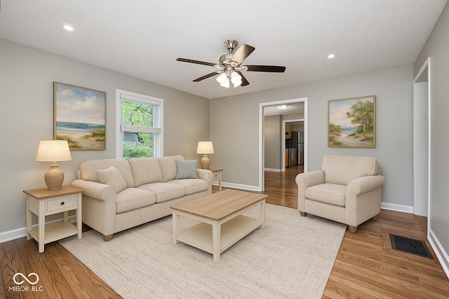 4621 E 17th St, Indianapolis, IN 46218 - living room featuring baseboards, a ceiling fan, wood finished floors, and recessed lighting