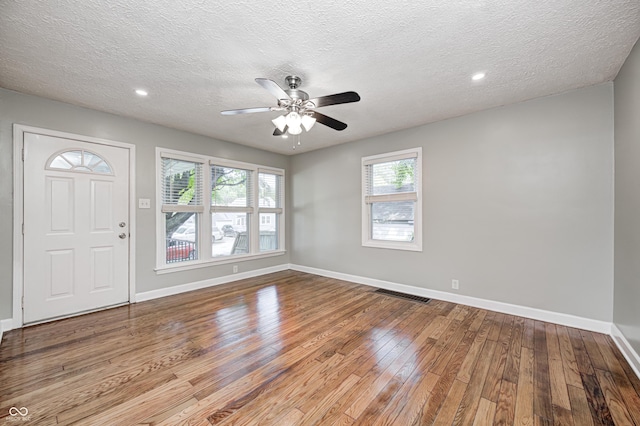 4621 E 17th St, Indianapolis, IN 46218 - entrance foyer featuring wood-type flooring, baseboards, a ceiling fan, a textured ceiling, and recessed lighting
