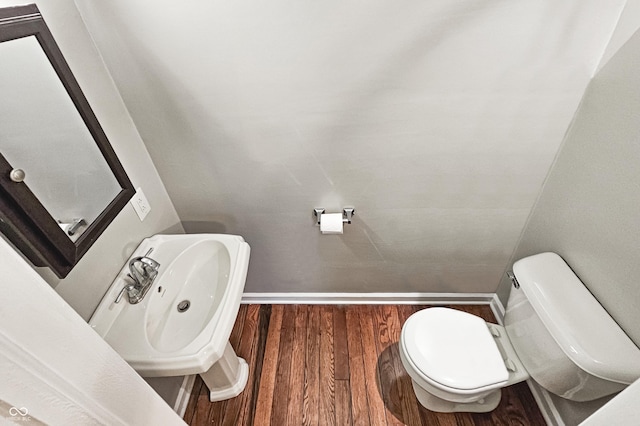 4621 E 17th St, Indianapolis, IN 46218 - half bath with toilet, wood finished floors, and a sink