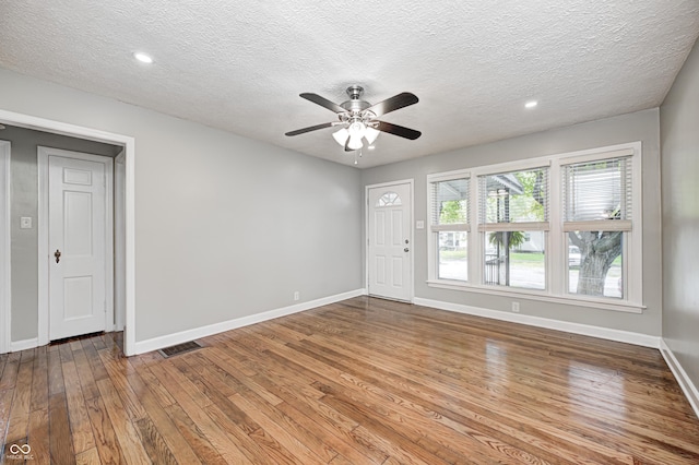 4621 E 17th St, Indianapolis, IN 46218 - unfurnished room featuring hardwood / wood-style flooring, ceiling fan, baseboards, a textured ceiling, and recessed lighting