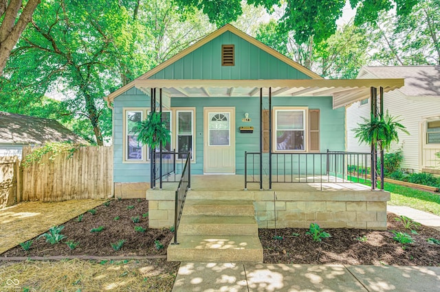 4621 E 17th St, Indianapolis, IN 46218 - bungalow-style house featuring a porch and board and batten siding