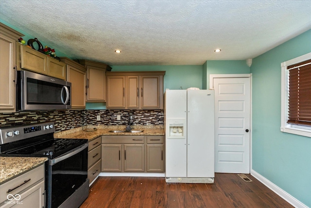 2519 N Boehning St, Indianapolis, IN 46219 - kitchen featuring stainless steel appliances, a sink, decorative backsplash, dark wood-style floors, and recessed lighting