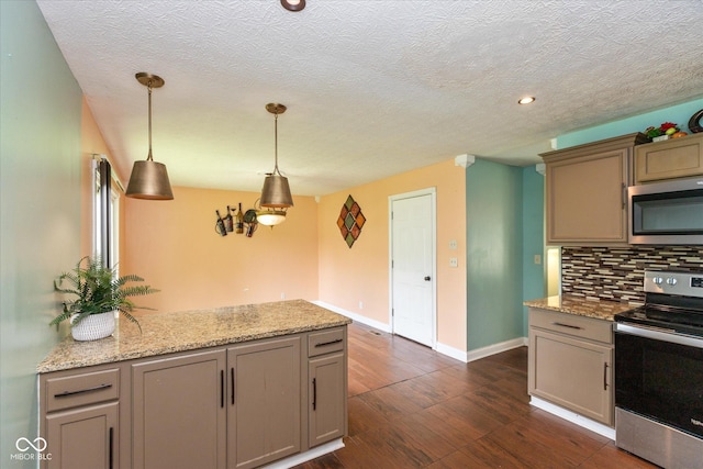 2519 N Boehning St, Indianapolis, IN 46219 - kitchen featuring stainless steel appliances, tasteful backsplash, dark wood-style floors, a peninsula, and baseboards