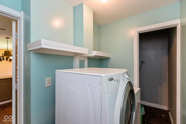 2519 N Boehning St, Indianapolis, IN 46219 - washroom with washer / dryer, dark wood-style floors, and baseboards