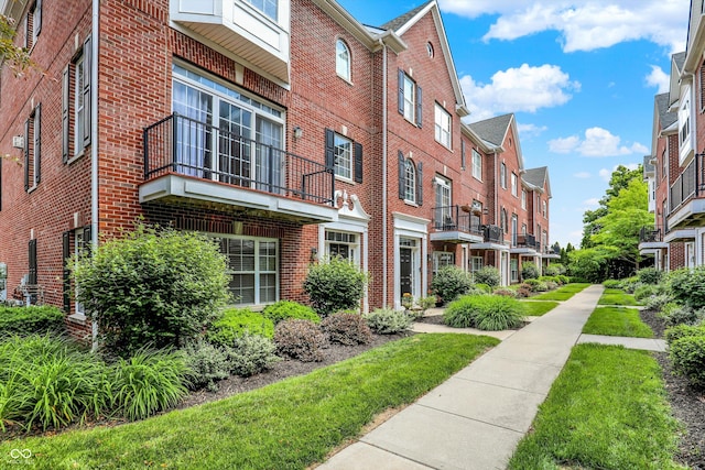 73 11th St NW, Carmel, IN 46032 - view of building exterior with a residential view