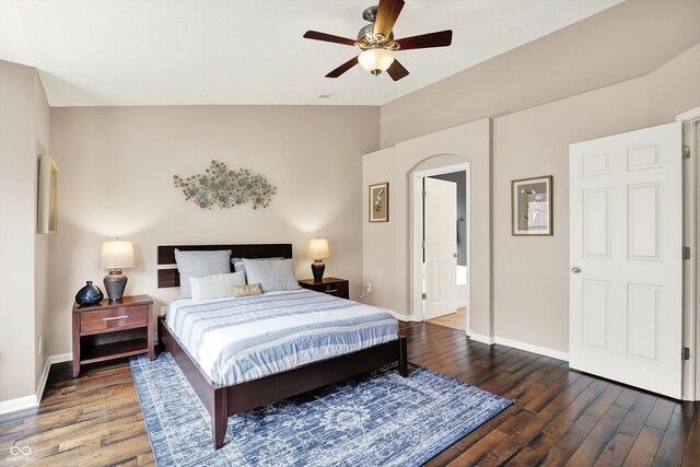 73 11th St NW, Carmel, IN 46032 - bedroom with wood finished floors, lofted ceiling, baseboards, and a ceiling fan