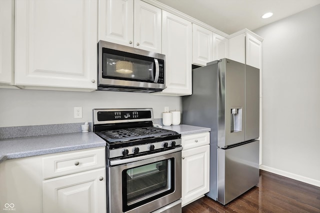 73 11th St NW, Carmel, IN 46032 - kitchen with stainless steel appliances, dark wood-type flooring, light countertops, white cabinetry, and recessed lighting