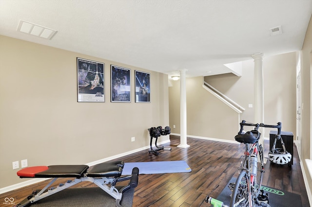 73 11th St NW, Carmel, IN 46032 - workout area featuring ornate columns, wood-type flooring, and baseboards