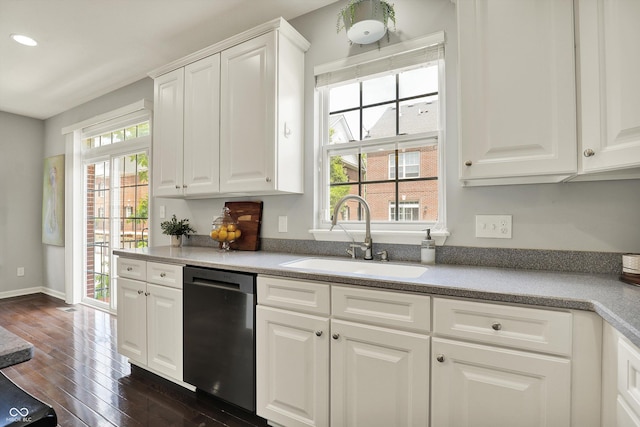 73 11th St NW, Carmel, IN 46032 - kitchen featuring dishwasher, a sink, healthy amount of natural light, dark wood-style flooring, and recessed lighting