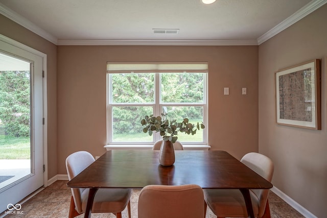 695 Overcup St, Westfield, IN 46074 - dining space with plenty of natural light, crown molding, and baseboards