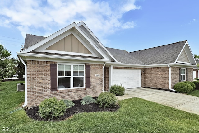 695 Overcup St, Westfield, IN 46074 - view of front of property featuring brick siding, an attached garage, a front yard, and driveway