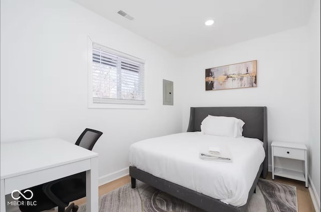 8744 Montery Ct, Indianapolis, IN 46226 - bedroom featuring wood finished floors, electric panel, baseboards, and recessed lighting