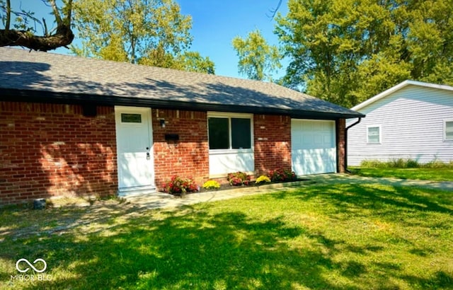 8744 Montery Ct, Indianapolis, IN 46226 - ranch-style house featuring brick siding, an attached garage, and a front yard