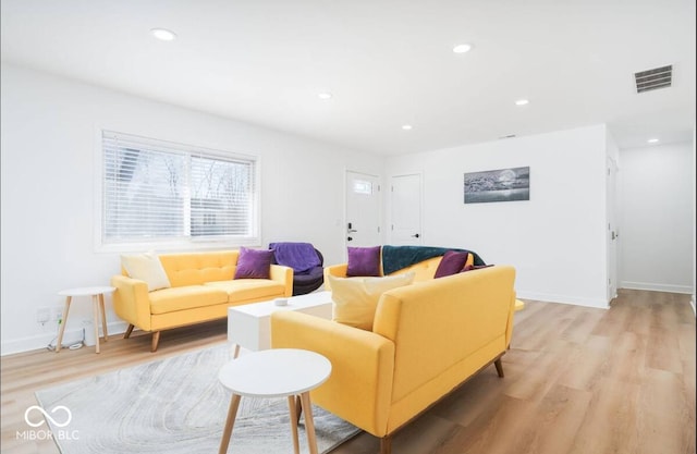 8744 Montery Ct, Indianapolis, IN 46226 - living room with light wood finished floors, recessed lighting, and baseboards