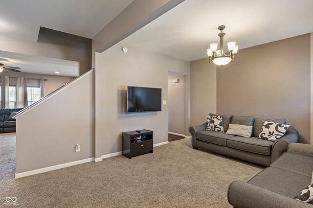 2626 Solidago Dr, Plainfield, IN 46168 - carpeted living area with baseboards, a chandelier, and ceiling fan