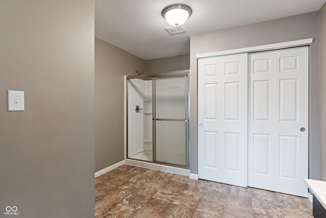2626 Solidago Dr, Plainfield, IN 46168 - full bathroom featuring a stall shower, baseboards, vanity, and stone finish flooring