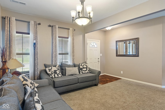 2626 Solidago Dr, Plainfield, IN 46168 - carpeted living area featuring a chandelier and baseboards