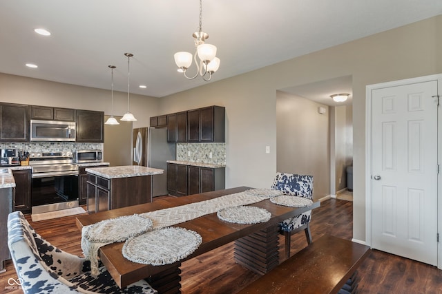 2626 Solidago Dr, Plainfield, IN 46168 - dining space with dark wood-style flooring, a chandelier, recessed lighting, and baseboards