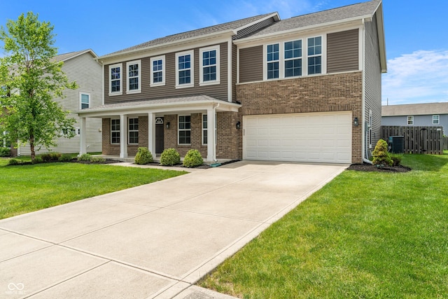 2626 Solidago Dr, Plainfield, IN 46168 - view of front of home featuring central AC, a garage, concrete driveway, a porch, and brick siding