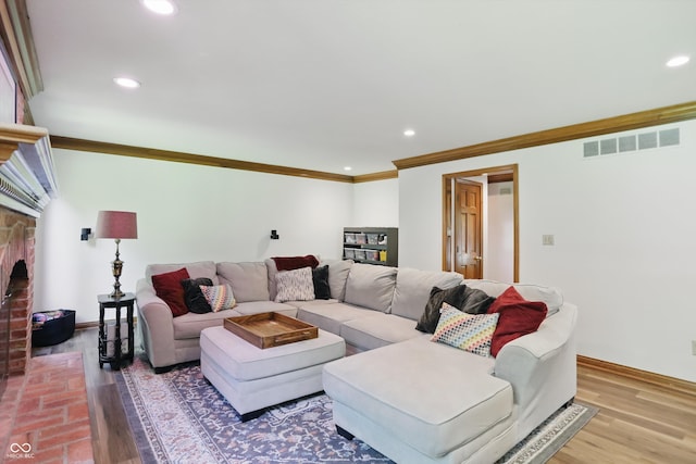 12335 Old Stone Dr, Indianapolis, IN 46236 - living room featuring crown molding, recessed lighting, baseboards, wood finished floors, and a fireplace