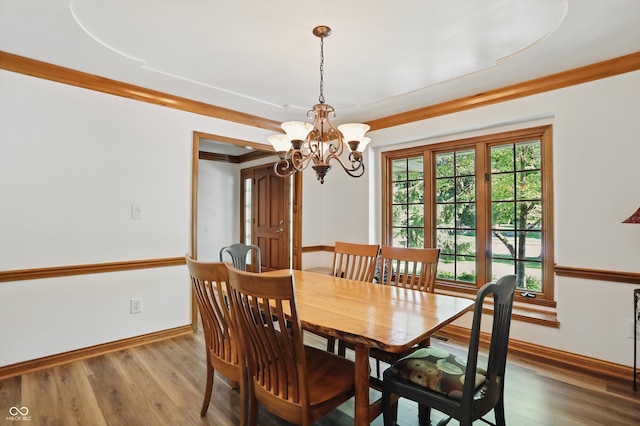 12335 Old Stone Dr, Indianapolis, IN 46236 - dining space with a chandelier, baseboards, and wood finished floors