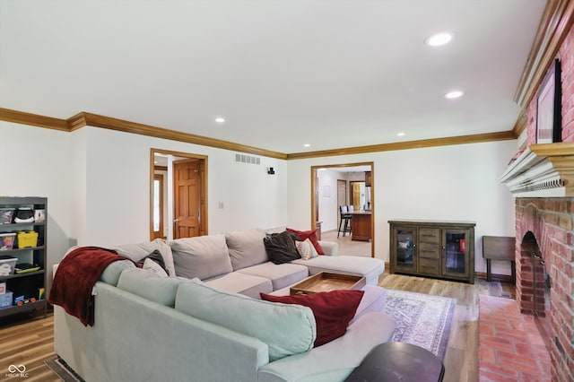 12335 Old Stone Dr, Indianapolis, IN 46236 - living room featuring crown molding, recessed lighting, and a fireplace