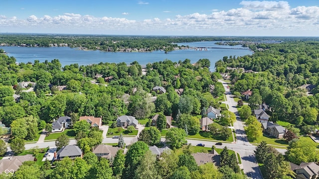 12335 Old Stone Dr, Indianapolis, IN 46236 - aerial perspective of suburban area featuring a nearby body of water and a heavily wooded area