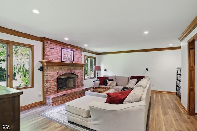 12335 Old Stone Dr, Indianapolis, IN 46236 - living area featuring crown molding, baseboards, light wood-style flooring, recessed lighting, and a fireplace