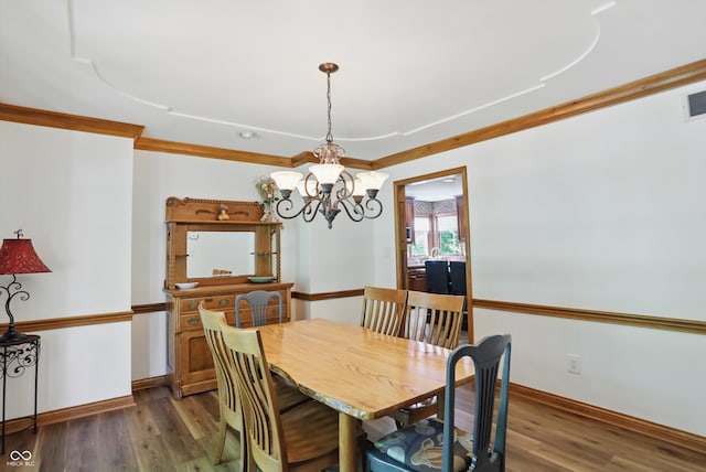 12335 Old Stone Dr, Indianapolis, IN 46236 - dining area featuring a chandelier, wood finished floors, baseboards, and ornamental molding
