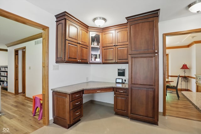 12335 Old Stone Dr, Indianapolis, IN 46236 - unfurnished office with built in desk, crown molding, baseboards, and light wood-type flooring