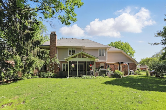 12335 Old Stone Dr, Indianapolis, IN 46236 - back of property with brick siding, a sunroom, a chimney, and a yard
