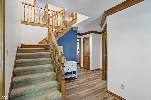 12335 Old Stone Dr, Indianapolis, IN 46236 - stairway featuring crown molding, baseboards, wood finished floors, and recessed lighting