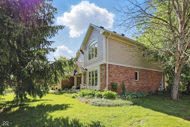 12335 Old Stone Dr, Indianapolis, IN 46236 - view of side of property featuring brick siding and a lawn