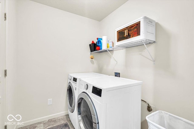 13495 Forest Glade Dr, Fishers, IN 46037 - laundry room with washer and dryer and baseboards