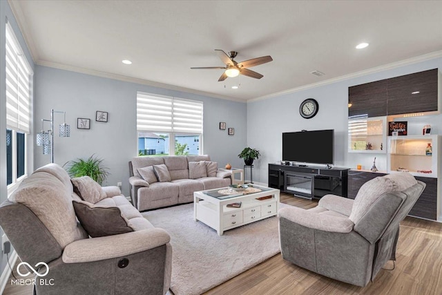 13495 Forest Glade Dr, Fishers, IN 46037 - living area featuring light wood-type flooring, a ceiling fan, ornamental molding, and recessed lighting