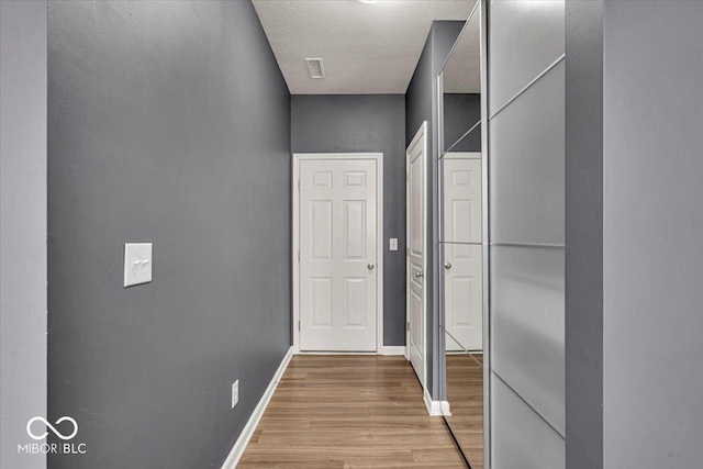 13495 Forest Glade Dr, Fishers, IN 46037 - hallway with wood finished floors and baseboards