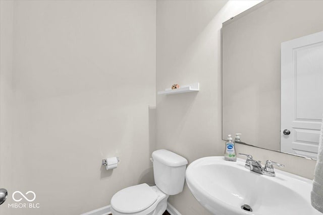 13495 Forest Glade Dr, Fishers, IN 46037 - bathroom featuring toilet, a sink, and baseboards