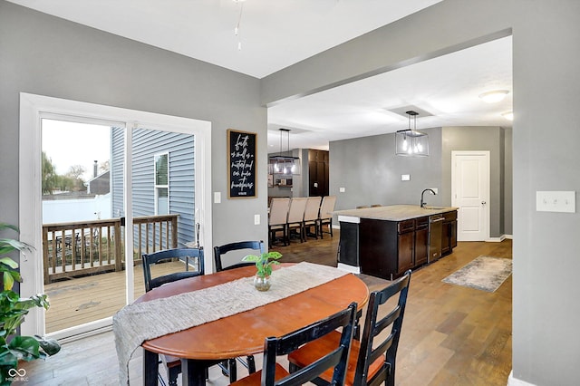 1664 Woodside Cir, Franklin, IN 46131 - dining area with light wood-style floors and baseboards