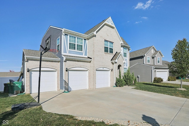 1664 Woodside Cir, Franklin, IN 46131 - view of front of home featuring driveway, brick siding, and an attached garage