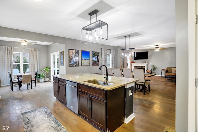 1664 Woodside Cir, Franklin, IN 46131 - kitchen featuring a ceiling fan, stainless steel dishwasher, open floor plan, and dark brown cabinets