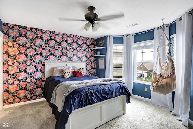 1664 Woodside Cir, Franklin, IN 46131 - bedroom with wallpapered walls, carpet flooring, an accent wall, and ceiling fan