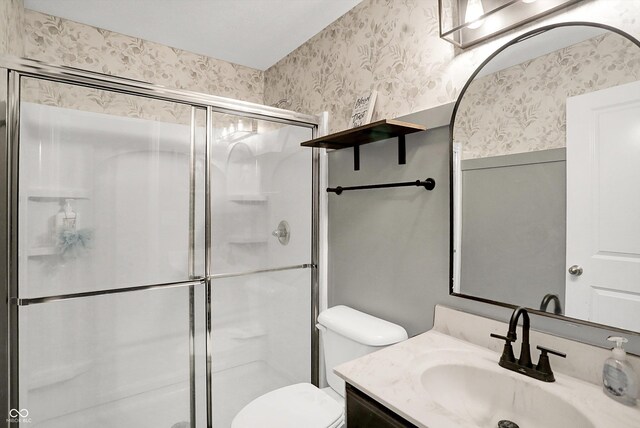 1664 Woodside Cir, Franklin, IN 46131 - full bathroom with wallpapered walls, vanity, and a shower stall