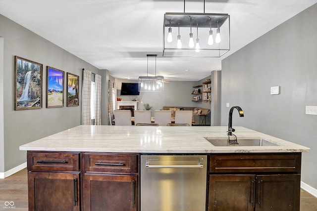 1664 Woodside Cir, Franklin, IN 46131 - kitchen with dishwasher, dark brown cabinets, open floor plan, and light stone counters