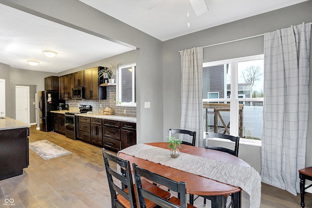 1664 Woodside Cir, Franklin, IN 46131 - dining area featuring light wood finished floors and ceiling fan