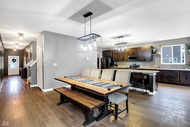 1664 Woodside Cir, Franklin, IN 46131 - dining space featuring dark wood-style floors and baseboards