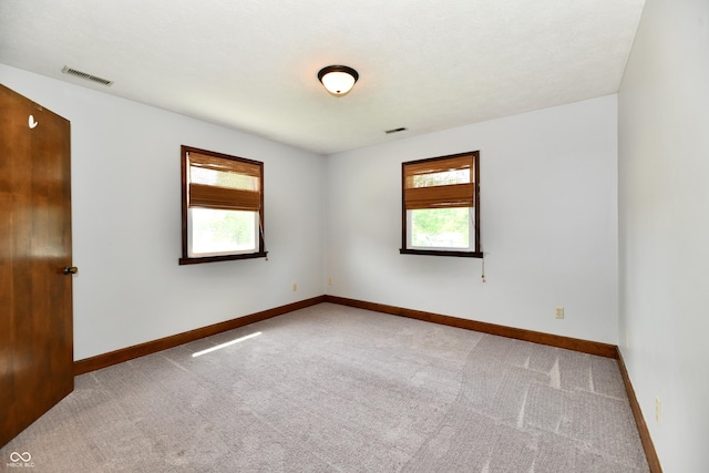 18906 Crestview Ct, Westfield, IN 46074 - carpeted empty room featuring plenty of natural light and baseboards