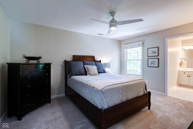 9154 Sargent Manor Ct, Indianapolis, IN 46256 - bedroom featuring light carpet, a ceiling fan, baseboards, and connected bathroom