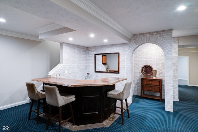 9154 Sargent Manor Ct, Indianapolis, IN 46256 - indoor wet bar with dark colored carpet, crown molding, baseboards, and recessed lighting