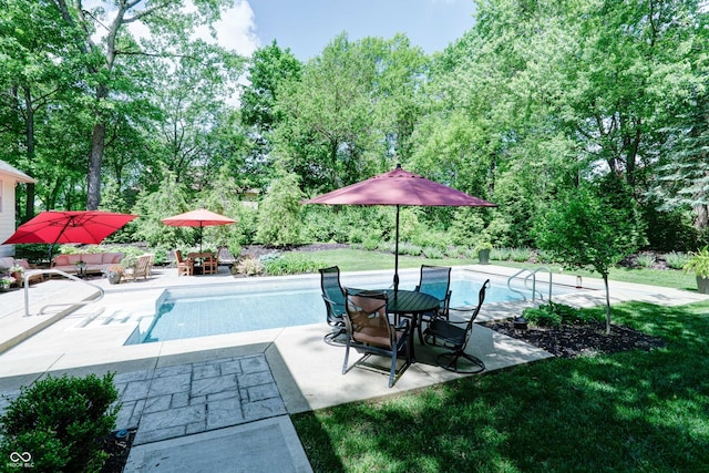 9154 Sargent Manor Ct, Indianapolis, IN 46256 - outdoor pool with a patio area, outdoor dining area, and view of wooded area